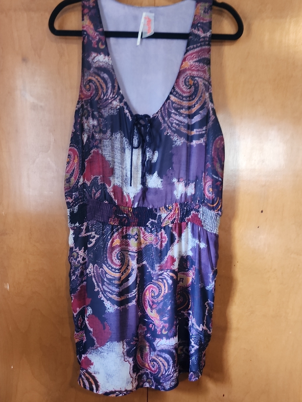 Free People lavender blouse with red logo detail